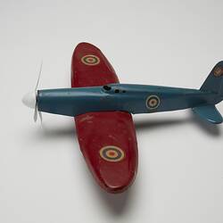 Blue and red toy aeroplane, left profile.