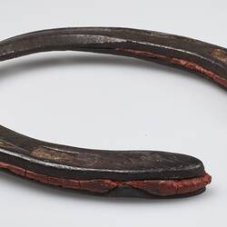 Handmade 'U' shaped metal horseshoe, with red rubber inserts.