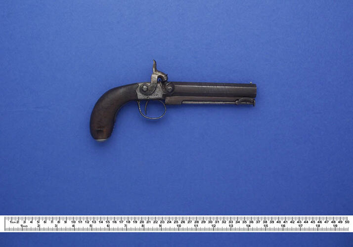 Small pistol with wooden handle
