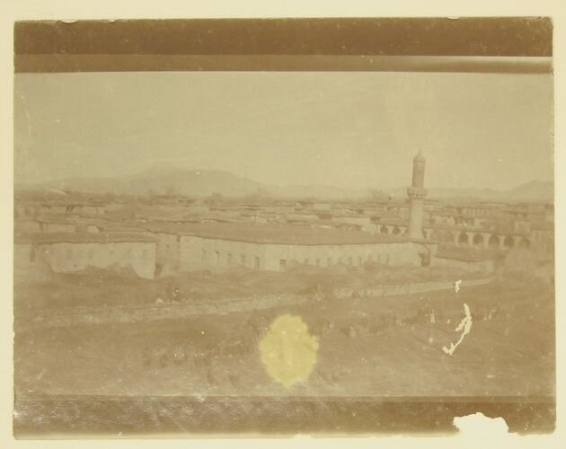 town with low buildings and minaret.