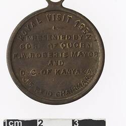 Round medal with text.