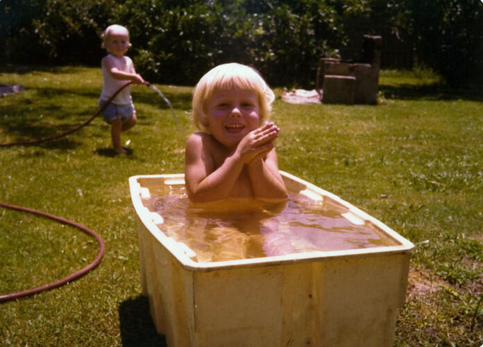 Digital Photograph - Child Playing in Tub of Water, Brighton East, 1976