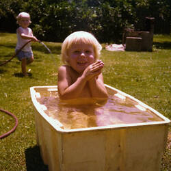Digital Photograph - Child Playing in Tub of Water, Brighton East, 1976
