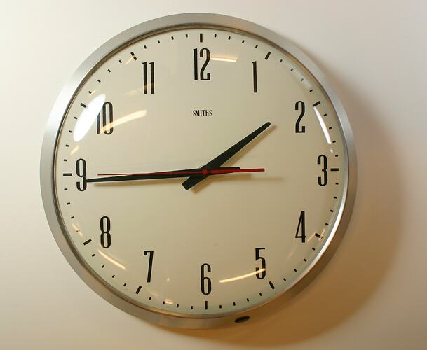 Round cream analog clock.