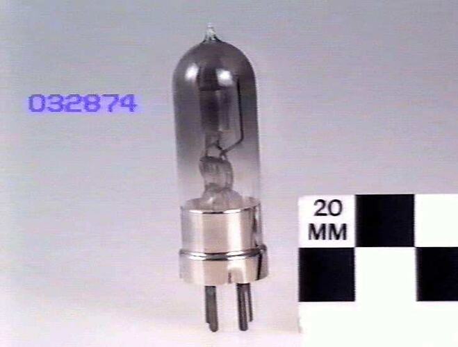 Tubular glass bulb with four pin base.