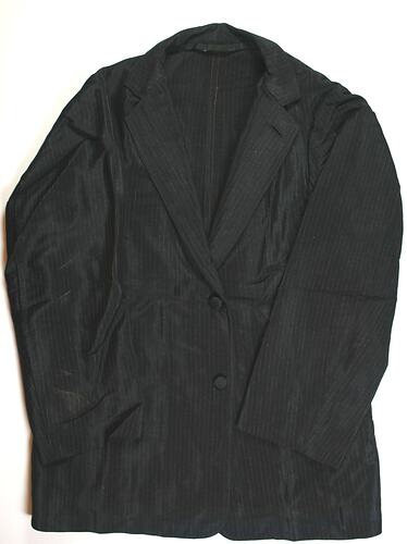 Black pinstripe jacket, two buttons down front.