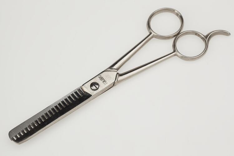 Scissors for hairdressing with special toothed blade.
