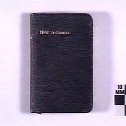Book with black cover and text.