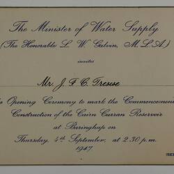 Rectangular buff-coloured card with blue printed cursive text and gilt edging.