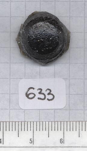 Button-shaped tektite.
