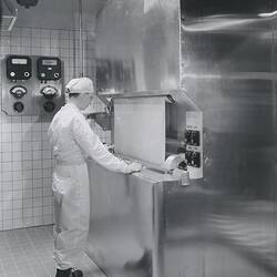 Photograph - Kodak, Worker Monitoring Film Base Receiving a Coating of Emulsion, Kodak Factory, circa 1965