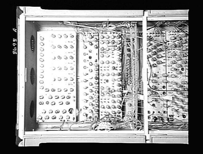 Open cabinet displaying valves and leads.
