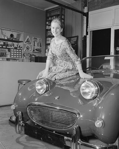Dent's Garage, Woman Sitting on a Car, Essendon, Victoria, 14 Aug 1959