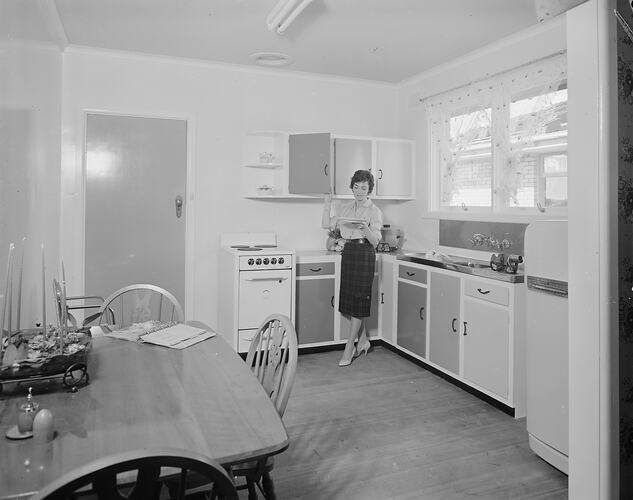 Woman Standing in a Kitchen, Bayswater, Victoria, 21 Aug 1959
