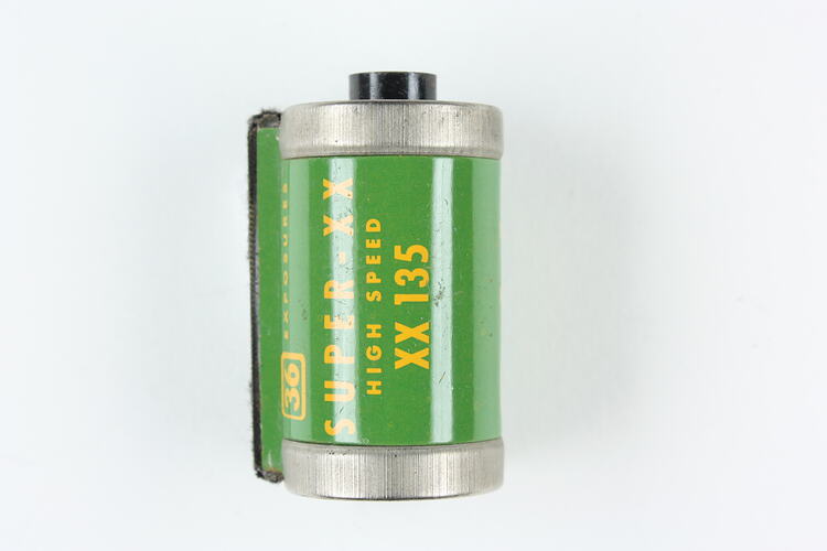 Cylindrical cartridge with green, pressed metal label.