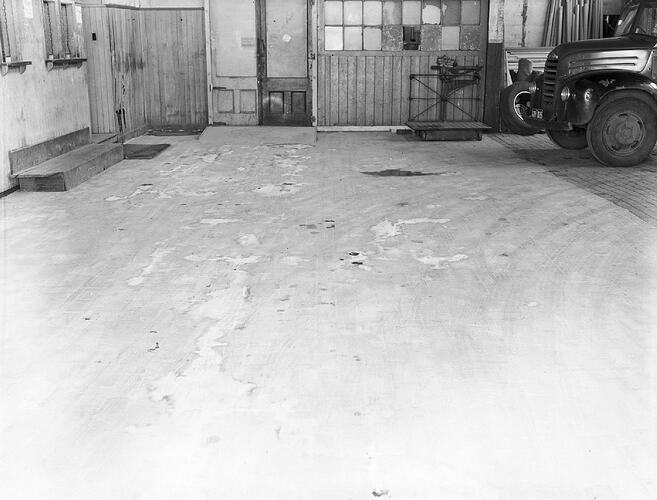 Monochrome photograph of a floor.