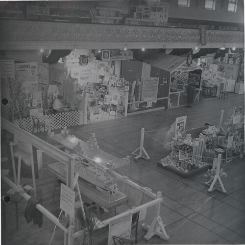 Corner of exhibition hall showing multiple stalls.
