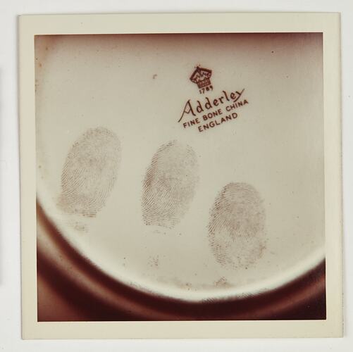 Fingerprints on the base of a china plate.