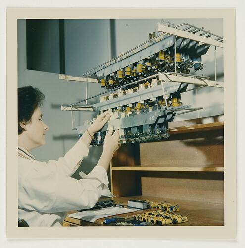 Slide 247, 'Extra Prints of Coburg Lecture', Worker Clipping Films Onto Rack, Building 20, Kodak Factory, Coburg, circa 1960s