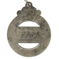 Back of round ring with central metal banner. Suspension ring.