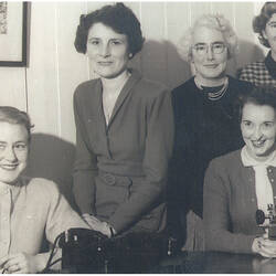 Black and white photograph of a female group.