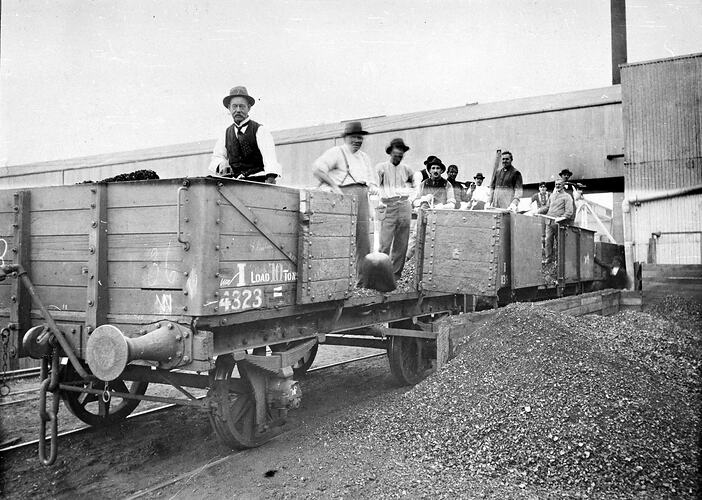 [Strikebreaking office workers unloading coal from wagons at the Sunshine Harvester Works, Sunshine, Melbourne, 1930s.]