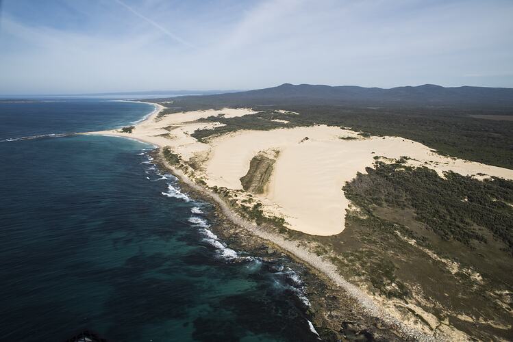Aerial view of dunes and coast.