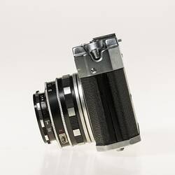 All-metal chrome and black body 35mm camera. Left profile.