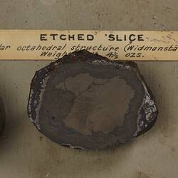 Three pieces of rock mounted to board.