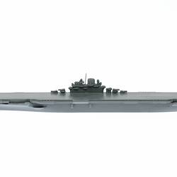 Grey ship model with mostly flat deck.