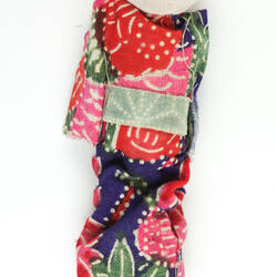 Small Japanese doll in kimono, back side.