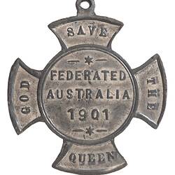 Crossed shaped medal with lettering.