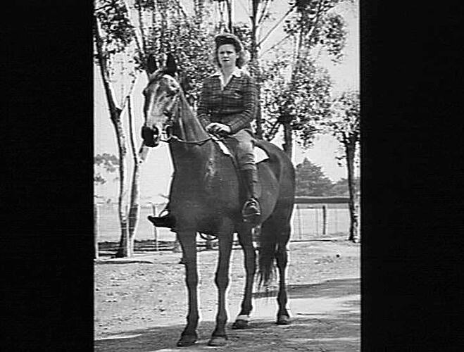 MISS NORMA RAYNOR (SEE P 83) NOV 1946. ON HORSEBACK - MISS NORMA RAYNOR (COST OFFICE) IS A KEEN HORSEWOMAN, AND REGULARLY RIDES HER HORSE `BILL' TO AND FROM WORK.