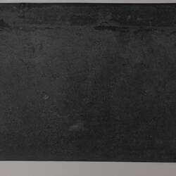 Rectangular black cardboard.