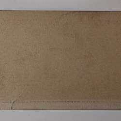 Back of off-white rectangular label.