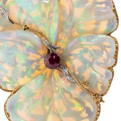 White opal, gold and silver brooch in the shape of a flower.