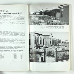 Open booklet with white pages and black printing. Houses on right page.