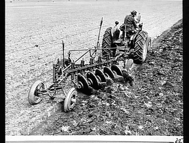 Photograph Mr. J. Campbell Ploughing Land with a M.H. 44K Tractor