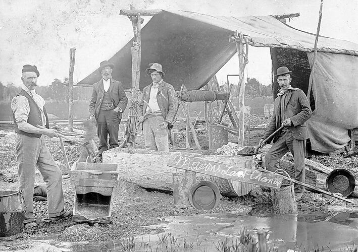 [Miners with pans and cradles in front of the entrance to Mason's Last Chance Mine shaft, Newbridge, near Bendigo, about 1875.]