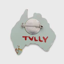 Back of acrylic Australia shaped brooch. White, red signature, horizontal pin.