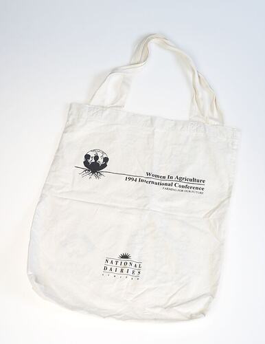 White cotton carry bag with black printing.