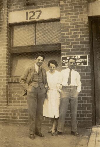 Digital Photograph - Two Men & One Woman outside Bush's Confectionary Factory, Richmond, circa 1935