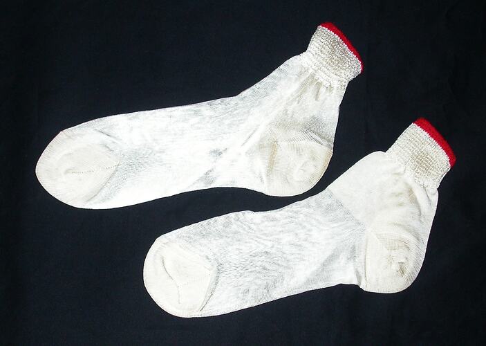 White ankle socks with red border at ankle.