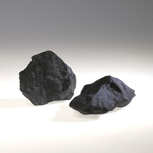 Two meteorite specimens.