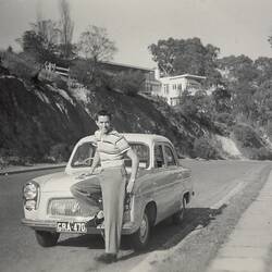Young man posing on Bonnet of Ford 'Prefect' Car, Yarra Boulevard, 1957