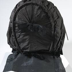 Back view of black bonnet.