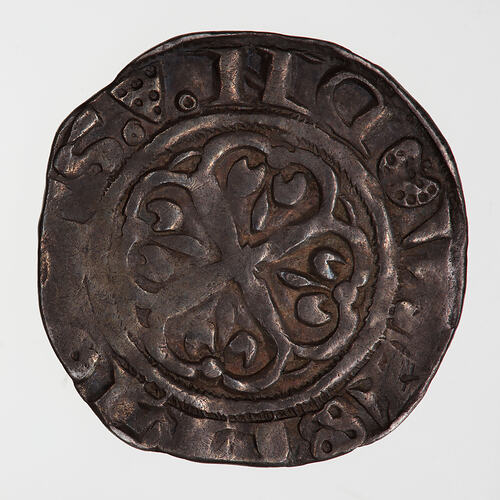 Coin, round, at the centre within a line circle a cross moline with a fleur-de-lis in each angle.