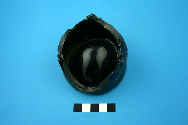 Dark green glass bottle base.
