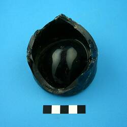 Dark green glass bottle base.