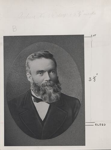 Head and shoulder portrait of man in suit.